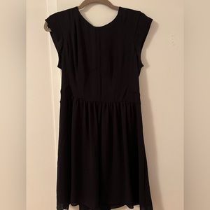 Black mini cress. A line bottom. Tshirt sleeve. Cool zipper detail. Formal wear